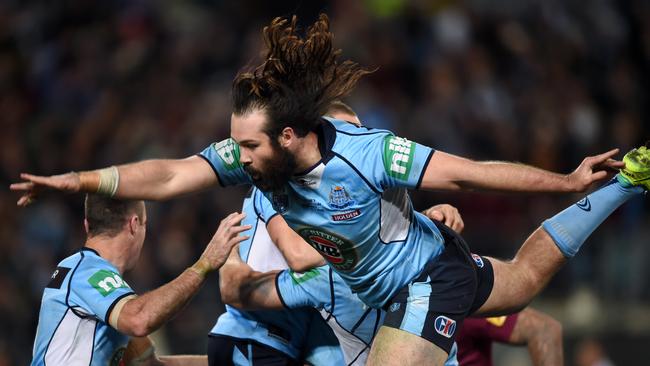 Oops. Aaron Woods of the Blues misses his teammates as he attempts to join their celebration after Origin III.
