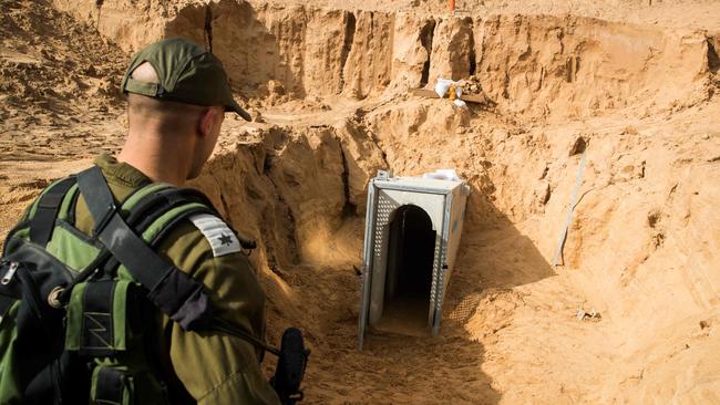 A picture taken in 2018 shows an Israeli army officer walking near the entrance of a tunnel leading from Gaza into Israel. Picture: AFP