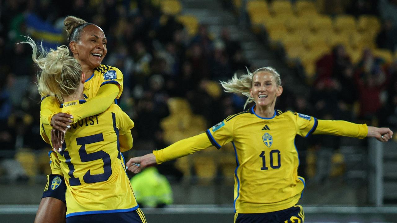 Sweden forward Rebecca Blomkvist (L) celebrates with teammate Madelen Janogy (2L) and Sofia Jakobsson (R). Picture: AFP