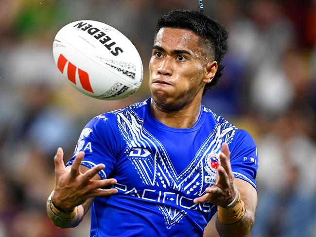 TOWNSVILLE, AUSTRALIA - OCTOBER 14: Sualauvi Faalogo of Samoa catches the ball during the Mens Pacific Championship match between Australia Kangaroos and Samoa at Queensland Country Bank Stadium on October 14, 2023 in Townsville, Australia. (Photo by Ian Hitchcock/Getty Images)