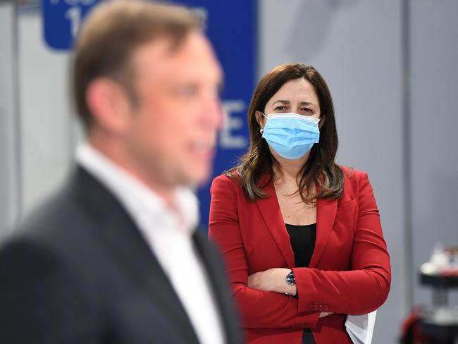 BRISBANE, AUSTRALIA - NewsWire Photos - SEPTEMBER 7, 2021.Queensland Premier Annastacia Palaszczuk watches Deputy Premier Steven Miles as he speaks during a press conference at the newly opened Covid-19 community vaccination hub at the Brisbane Entertainment Centre in Boondall.Picture: NCA NewsWire / Dan Peled