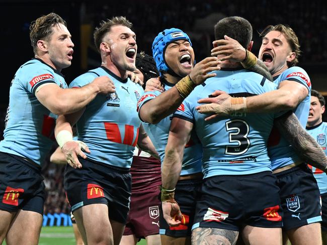 NSW players celebrate the try of Bradman Best during the State of Origin game three match between the Queensland Maroons and the New South Wales Blues at Suncorp Stadium in Brisbane, Wednesday, July 17, 2024. (AAP Image/Darren England) NO ARCHIVING, EDITORIAL USE ONLY