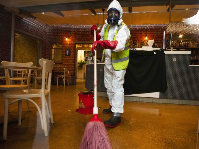 A cleaner attending to the deep clean of the Greek on Halifax Street. Picture: Emma Brasier