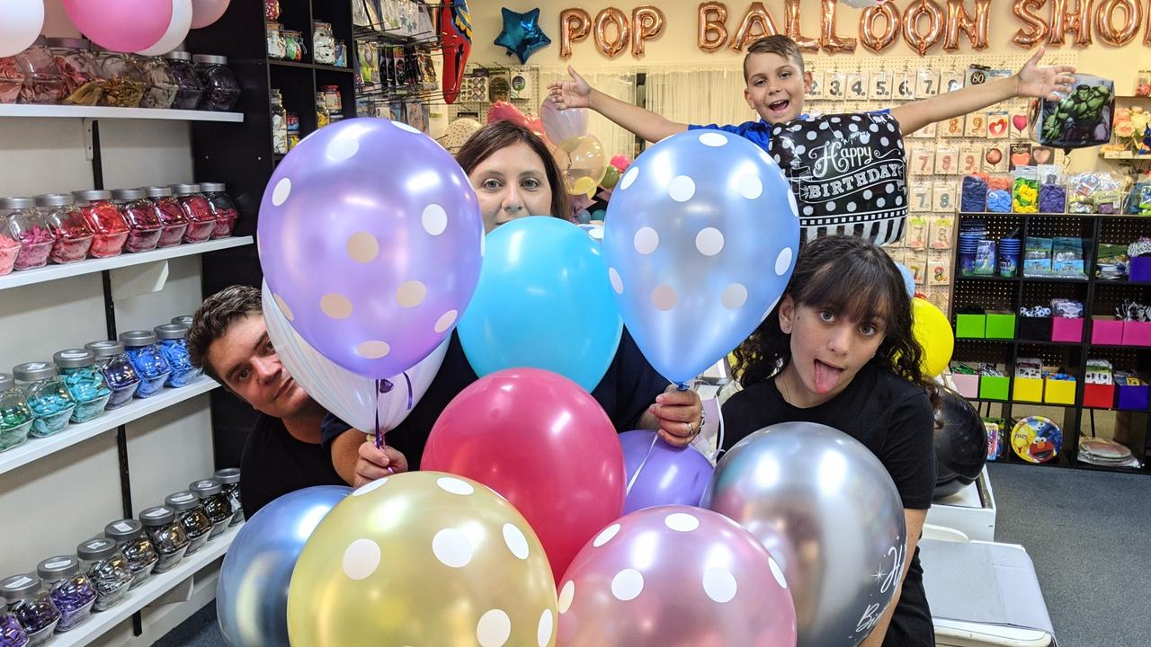 Bradley and Katrina Drinnan and their children Joseph, 10 and Ella, 15, have opened Pop Balloon Shop at Golden Beach.