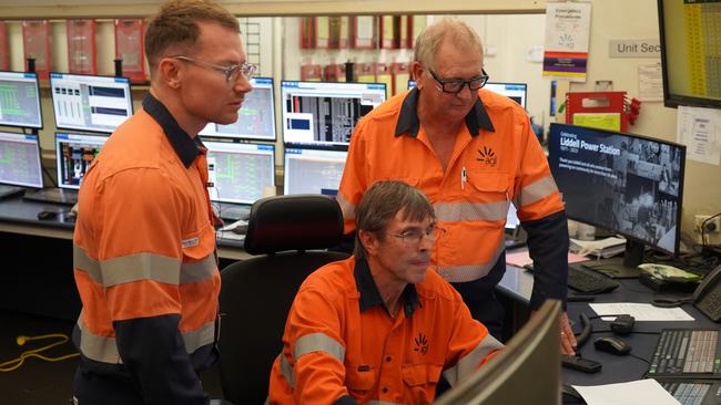 Workers inside the Liddell Power Station control room on its final day of operation.