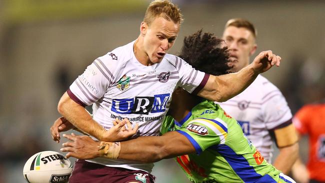 Manly’s Daly Cherry-Evans loses the ball in a tackle against the Raiders. Photo: Getty Images.