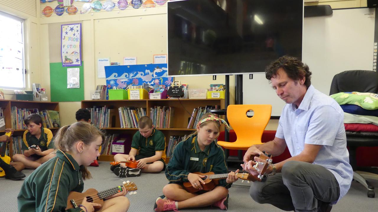 Matt Wild gave students some pointers to help them rock on the ukulele. Photo/Holly Cormack.