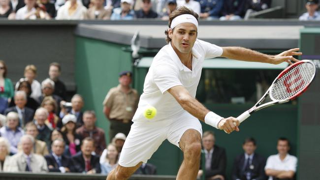 Federer returns the ball during the final tennis match of the 2008 Wimbledon championships against Spain's Rafael Nadal, 2008. Picture: Adrian Dennis/AFP