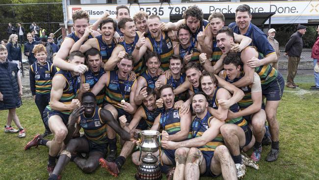 St Kevins OB players celebrate their record premiership. Picture: Valeriu Campan