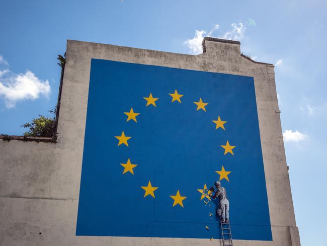 DOVER, ENGLAND - MAY 09:  A recently painted mural by British graffiti artist Banksy, depicting a workman chipping away at one of the stars on a European Union (EU) themed flag is pictured on May 9, 2017 in Dover, England. The work is the latest by Banksy, the anonymous England-based graffiti artist and political activist.  (Photo by Carl Court/Getty Images) *** BESTPIX ***