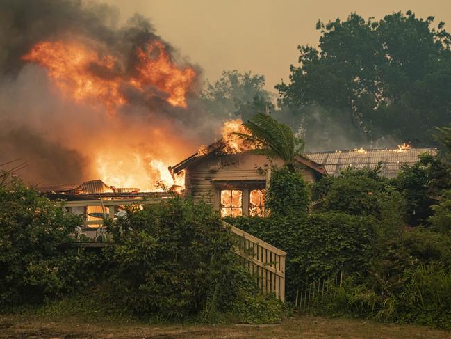 Fire crews did everything they could to save this home in Batlow. Picture: Daniel Shaw and Timothy Dean