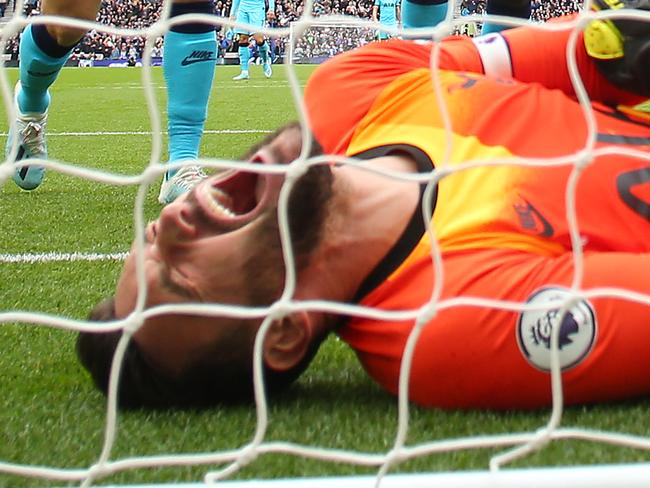 BRIGHTON, ENGLAND - OCTOBER 05: Hugo Lloris of Tottenham Hotspur goes down injured during the Premier League match between Brighton & Hove Albion and Tottenham Hotspur at American Express Community Stadium on October 05, 2019 in Brighton, United Kingdom. (Photo by Bryn Lennon/Getty Images)