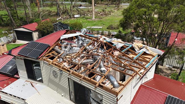 Storm recovery at Oxenford. Adam Baileys house on California Drive lost its roof. Picture Glenn Hampson