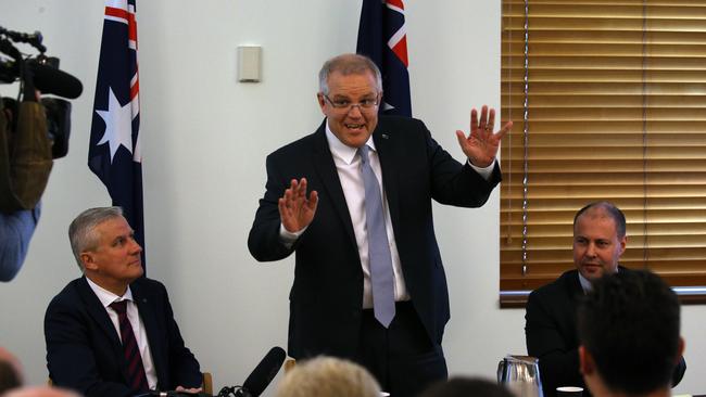 Prime Minister Scott Morrison with Nationals leader Michael McCormack and deputy Liberal leader Josh Frydenberg during a joint party room meeting in September. Picture: Gary Ramage