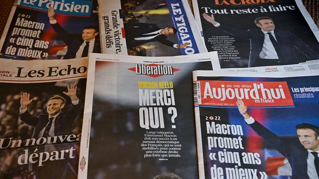 Monday’s front pages of the French newspapers show President Emmanuel Macron after beating his far-right rival Marine Le Pen for a second five-year term. Picture: Getty Images