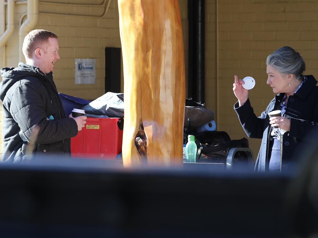 Actors Luke McGregor and Kris McQuade taking a break on location for the production of Rosehaven season 3 at the Longley International Hotel. Picture: LUKE BOWDEN