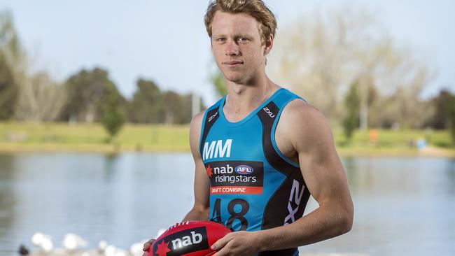 Five AFL stars of the future will be heading off to draft camp. The guys are pictured wearing new tops, each colour represents a postion on the ground, they are pictured at Albert Park Lake. Callum Mills (NSW). Picture: Sarah Matray