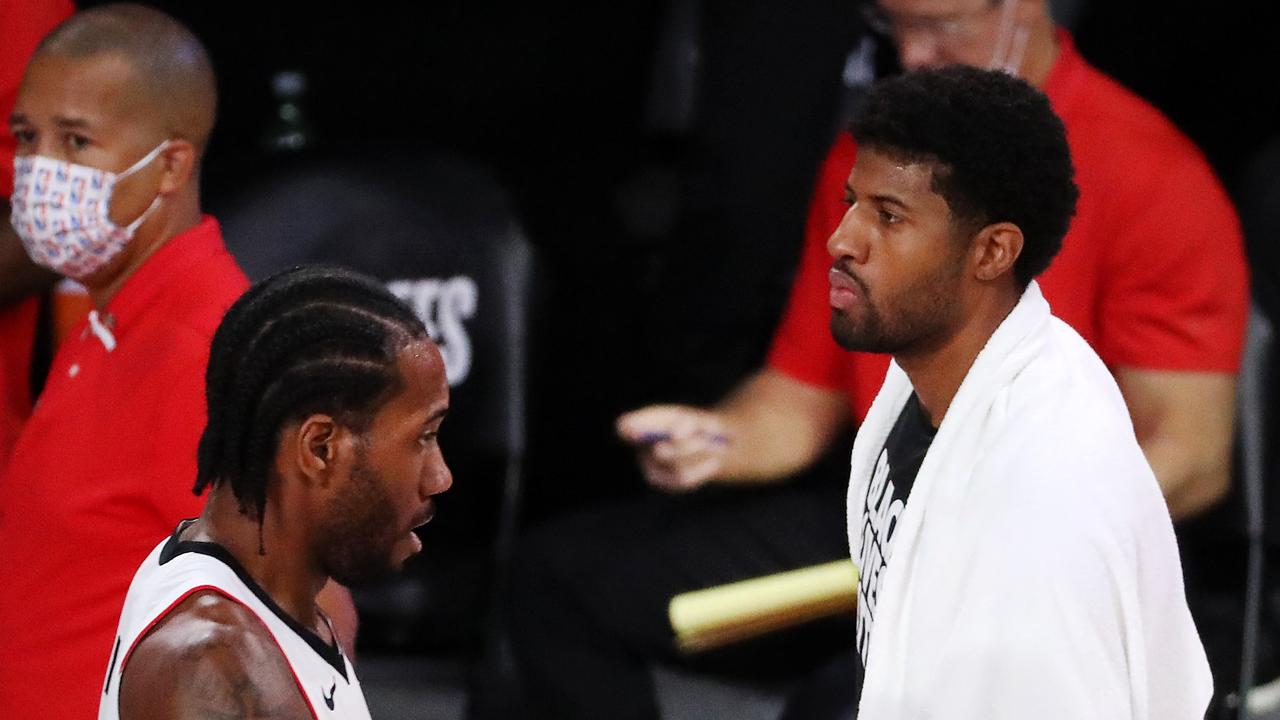 LAKE BUENA VISTA, FLORIDA - SEPTEMBER 13: Kawhi Leonard #2 of the LA Clippers and Paul George #13 of the LA Clippers react during the first quarter against the Denver Nuggets in Game Six of the Western Conference Second Round during the 2020 NBA Playoffs at AdventHealth Arena at the ESPN Wide World Of Sports Complex on September 12, 2020 in Lake Buena Vista, Florida. NOTE TO USER: User expressly acknowledges and agrees that, by downloading and or using this photograph, User is consenting to the terms and conditions of the Getty Images License Agreement. Michael Reaves/Getty Images/AFP == FOR NEWSPAPERS, INTERNET, TELCOS &amp; TELEVISION USE ONLY ==