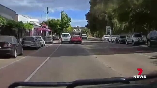 ‘Appalling’ road rage incident as a van and car refuse to merge (7NEWS)