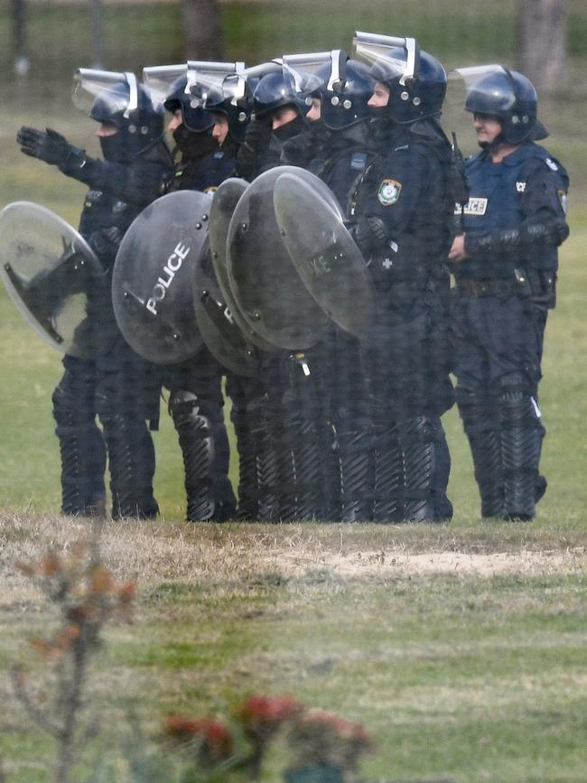 Riot Police preparing to storm the rooftop at a NSW juvenile justice centre on the Central Coast. Picture: AAP