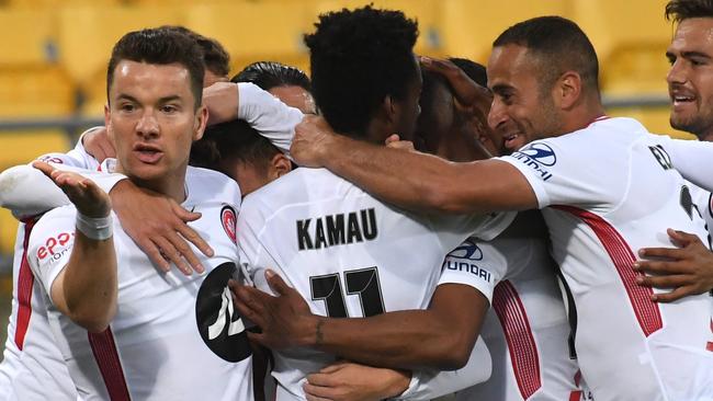 Western Sydney Wanderers players celebrate after Alex Baumjohann (left) scored against Wellington Phoenix on Saturday. Picture: AAP