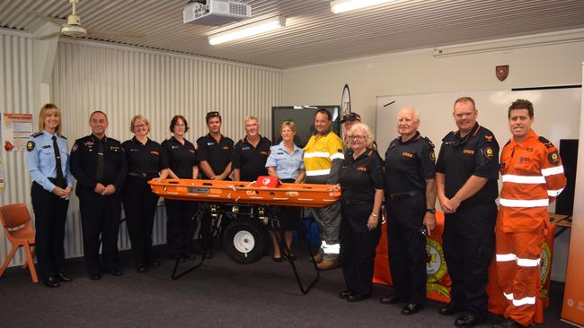 New equipment has been handed over to Whitsunday SES members at a ceremony in Proserpine. Pictured from left are Selina Neill, central region assistant commissioner Darryl King, Wendy Camm, Leigh Munro, Daniel Moss, Mark Connors, Christine Persello, Ergon Energy acting area manager Damian Pennisi, Barry Lake, Sue Connors, Dick Filewood, Douglas Connors and Chris Harvey. Photo: Elyse Wurm