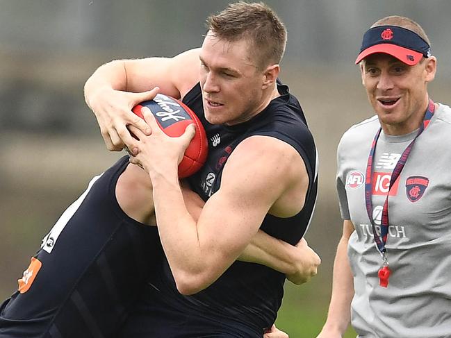 MELBOURNE, AUSTRALIA - DECEMBER 14: Tom McDonald of the Demons is tackled during a Melbourne Demons AFL training session at Gosch's Paddock on December 14, 2018 in Melbourne, Australia. (Photo by Quinn Rooney/Getty Images)