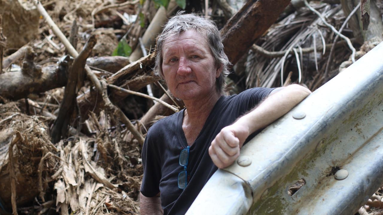 Cape Tribulation resident Stephen Maloney, standing amidst the wreckage near Rykers Creek, is frustrated with the lack of assistance provided following ex-Tropical Cyclone Jasper.