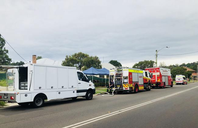 Fire and Rescue NSW members have been on the scene since about 9.30am. Picture: Daniel Zautsen