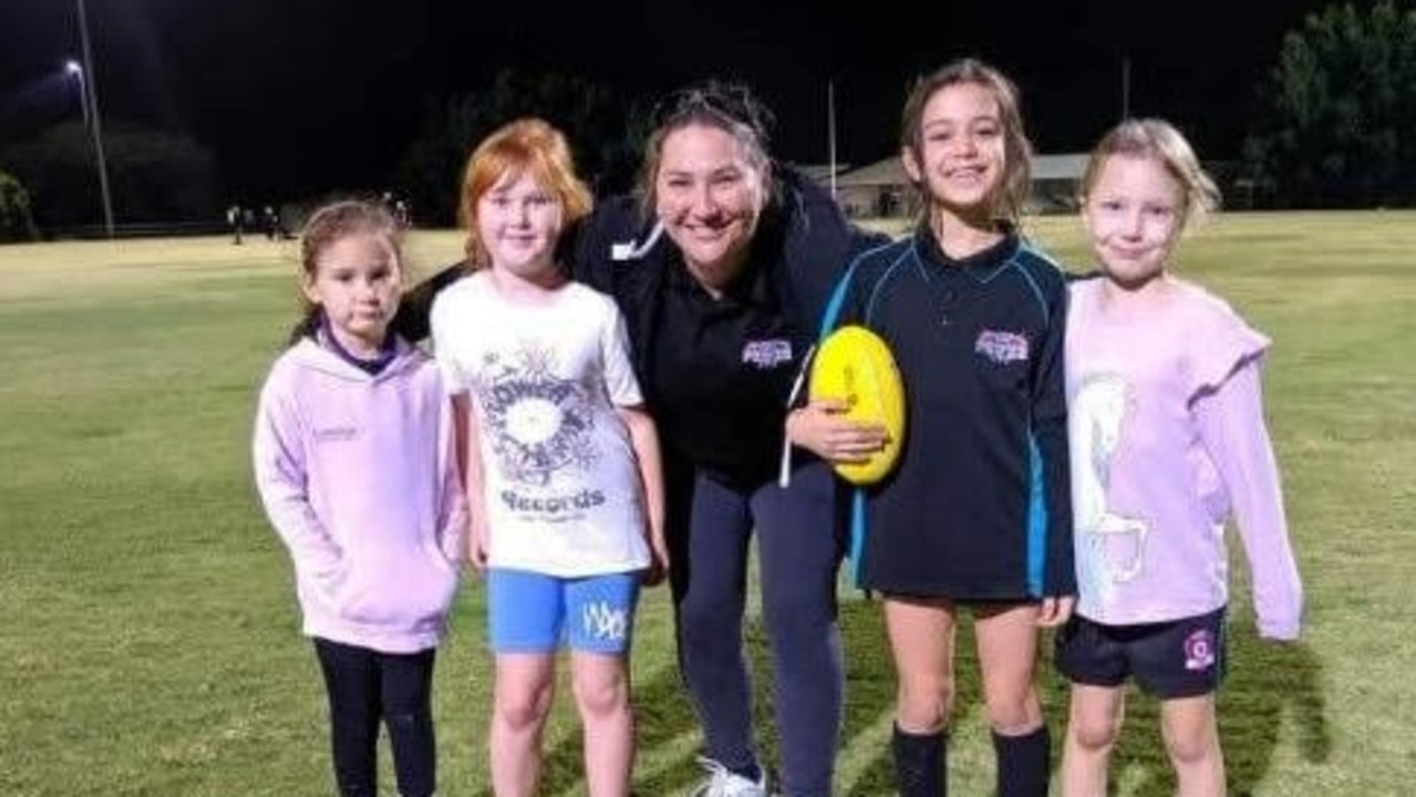 Cristelle Mulvogue, middle, with some of the club's Auskick kids.