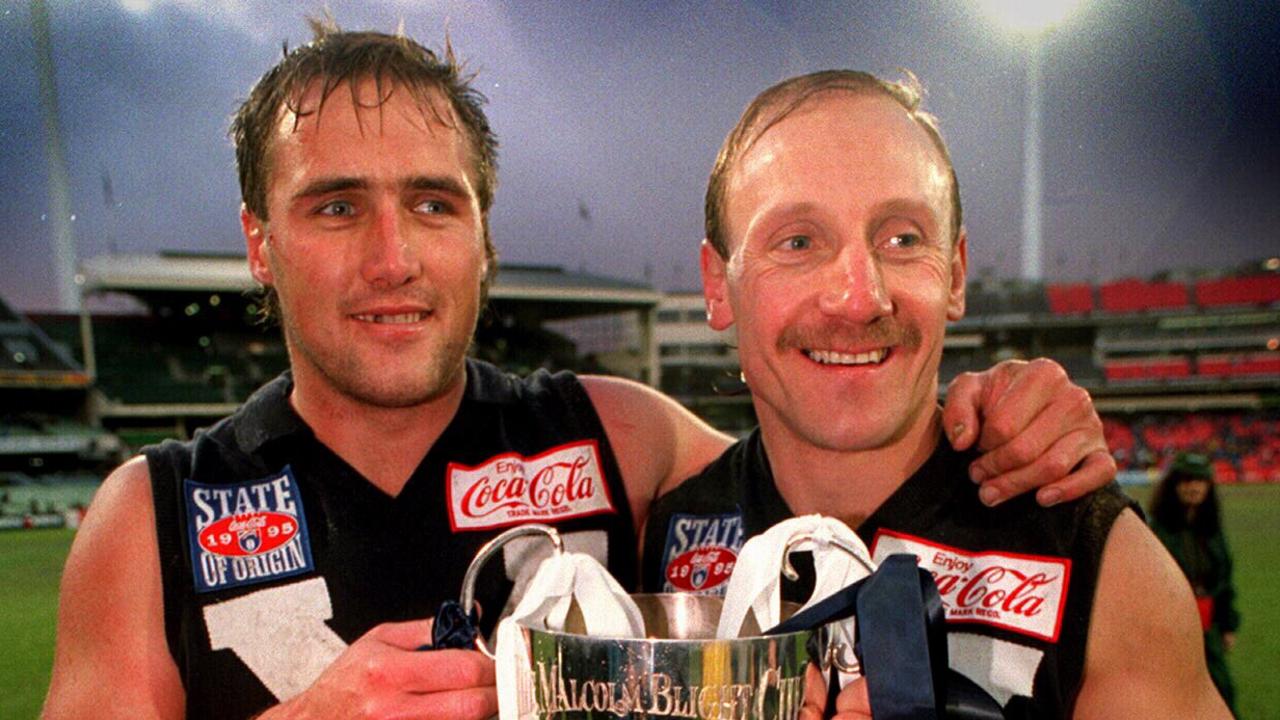 AFL legends Tony Lockett (L) &amp; Gary Ablett playing for Victoria in 1995