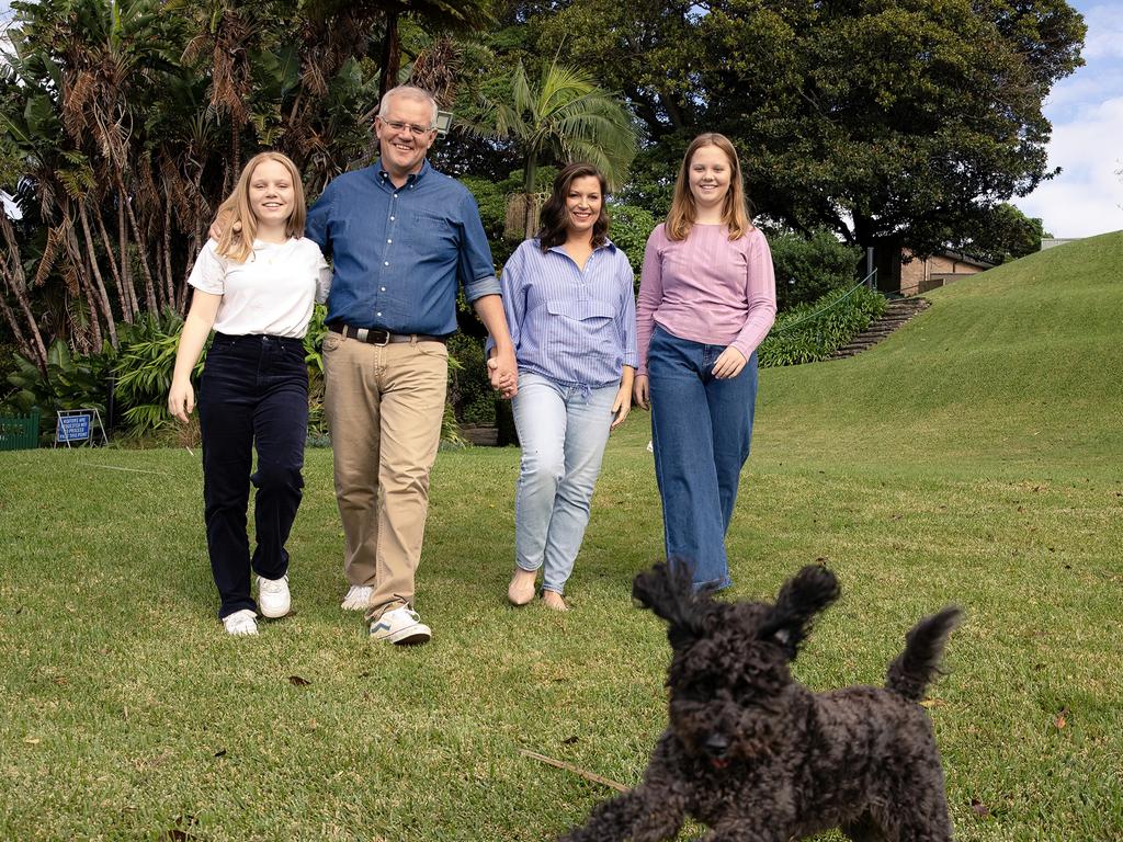 Buddy captures the attention of the Morrison family at Kirribilli House. Picture: Jason Edwards