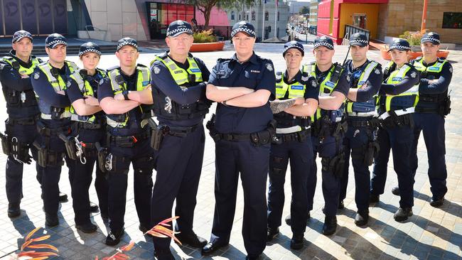 Senior Sergeant Mel Nixon (centre), with members of the Frontline Tactical Unit from Southern Metro Division 3, at Harmony Square, one of the hot spots they have targeted as part of the operation. Picture: Nicki Connolly