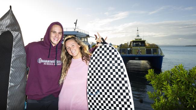 Will and Chloe Ireland were excited to go surfing again at North Stradbroke Island, having missed out for the past two months. Picture: Renae Droop