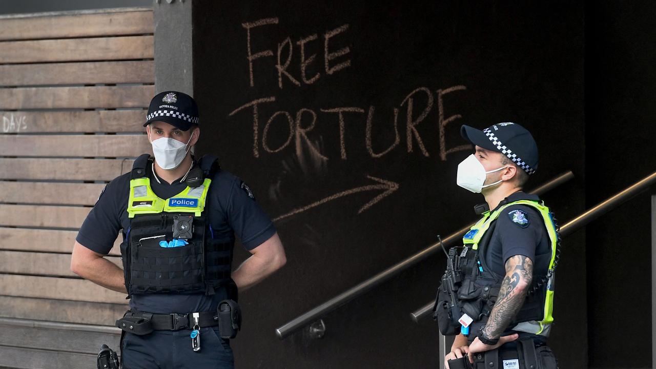 Police stand guard outside a government detention centre where Serbia's tennis champion Novak Djokovic is reported to be staying in Melbourne. Picture: William West/AFP