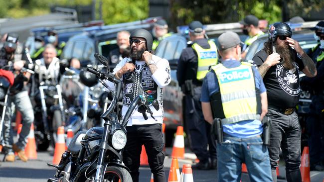 Police intercept members of a motorcycle gang as they leave their clubhouse. Picture: Andrew Henshaw