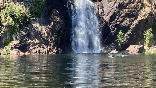 Joel and Meghan Bennett were rescued by two men in a tinnie at Wangi Falls after another man was attacked by a 2m croc in the water.