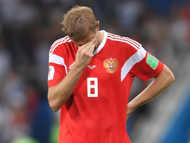 SOCHI, RUSSIA - JULY 07: Iury Gazinsky of Russia shows his dejection following his team's defeat in the 2018 FIFA World Cup Russia Quarter Final match between Russia and Croatia at Fisht Stadium on July 7, 2018 in Sochi, Russia.  (Photo by Laurence Griffiths/Getty Images)