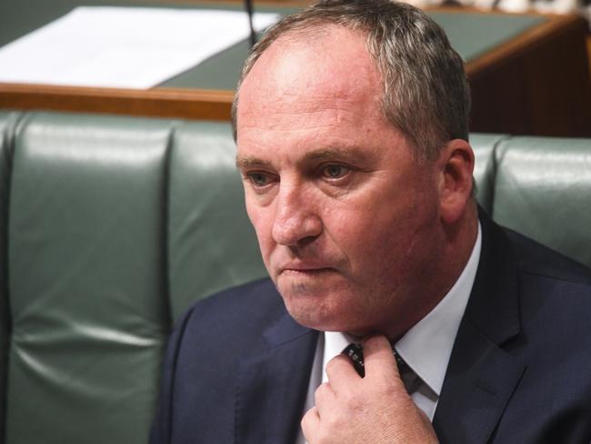 Australian Deputy Prime Minister Barnaby Joyce reacts during House of Representatives Question Time at Parliament House in Canberra, Monday, February 12, 2018.  (AAP Image/Lukas Coch) NO ARCHIVING