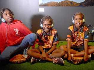 Rhonda Miller, Lesley Adams and Danielle Watson listen to their 'deadly' recordings at the Rockhampton art gallery. Picture: Jann Houley