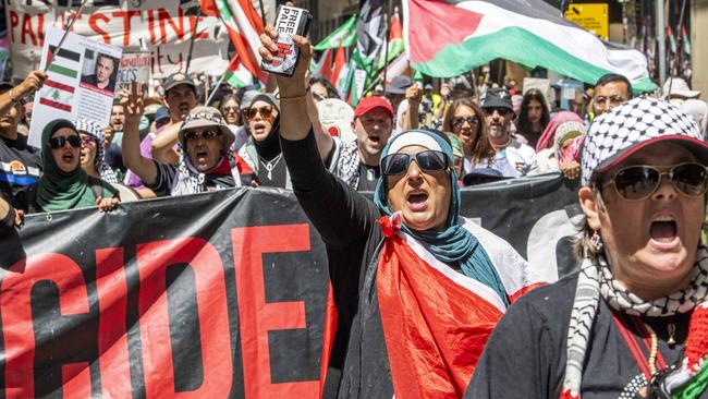 Pro-Palestine protesters march through the Sydney CBD on Sunday despite the ceasefire in Gaza. Picture: Simon Bullard.