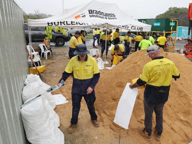 Locals flocked to sandbagging stations as Cyclone Alfred approaches the Gold Coast. The Reedy Creek depot staff worked tirelessly but people had a two hour wait and the queue snaked around the surrounding streets. Picture Glenn Hampson