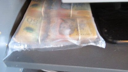 Gold Coast police have seized drugs and a large sum of cash after raiding a Currumbin Waters home. Photo QLD Police