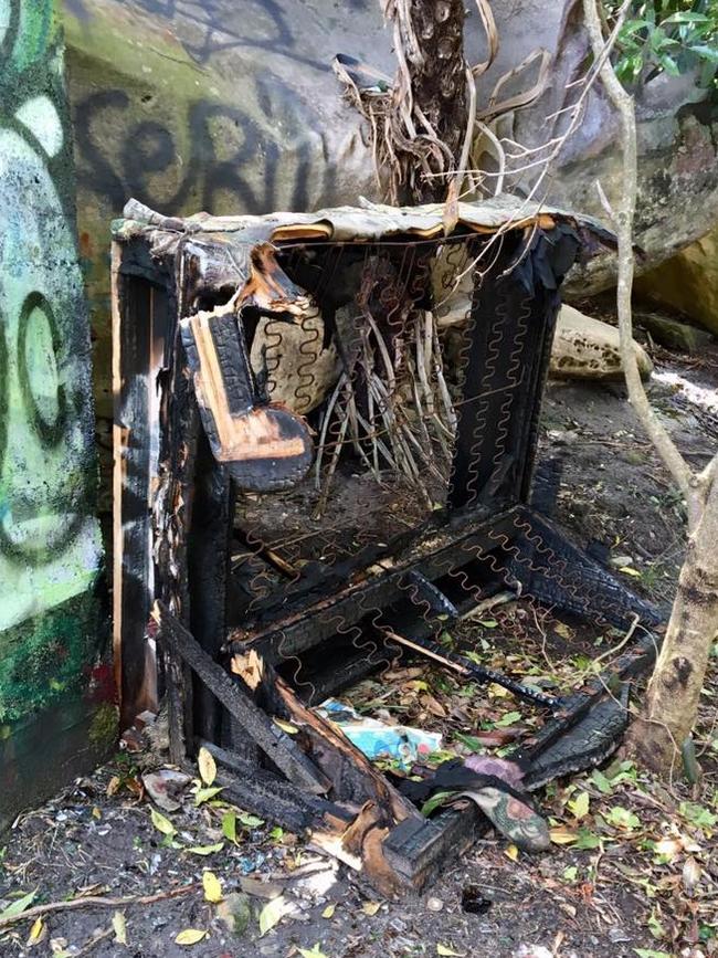 A burnt out bed and dumped other rubbish near the Cutler Road Lookout in Sydney Harbour National Park on Dobroyd Head, Clontarf.