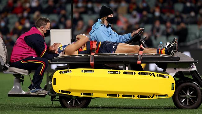 Will Hamill comes off injured after clashing his head in a friendly fire incident. Picture: AFL Photos via Getty Images