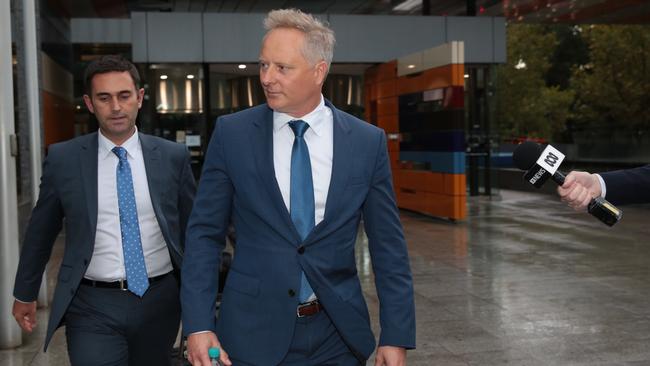 CEO and Senior Financial Advisor at Henderson Maxwell, Sam Henderson (right) leaves the Federal Court, Melbourne, Tuesday, April 24, 2018. The financial services royal commission public hearing into financial advice continues in Melbourne. (AAP Image/Stefan Postles) NO ARCHIVING