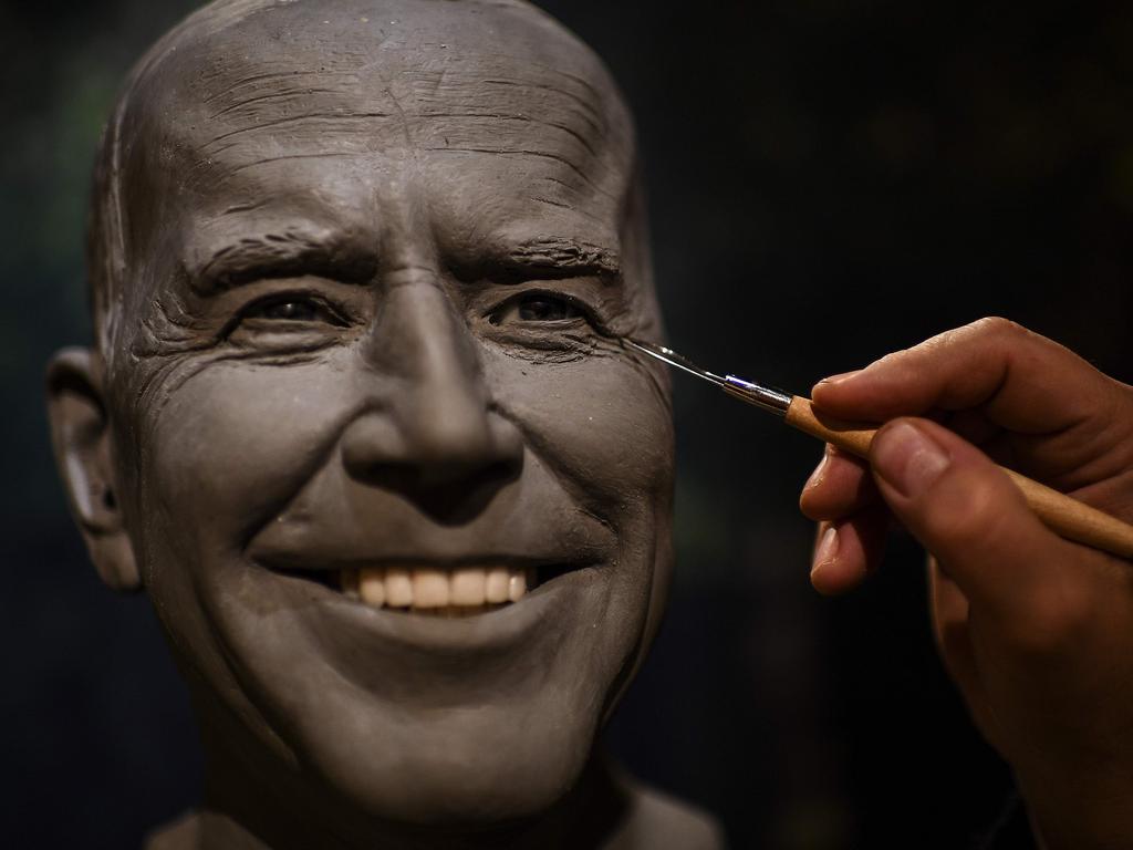 Sculptor Claus Velte works on a wax statue of Joe Biden before its installation at the Grevin wax museum in Paris. Picture: AFP