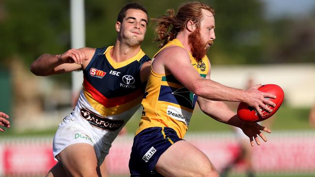 Eagles’ Angus Poole gets away with the ball.