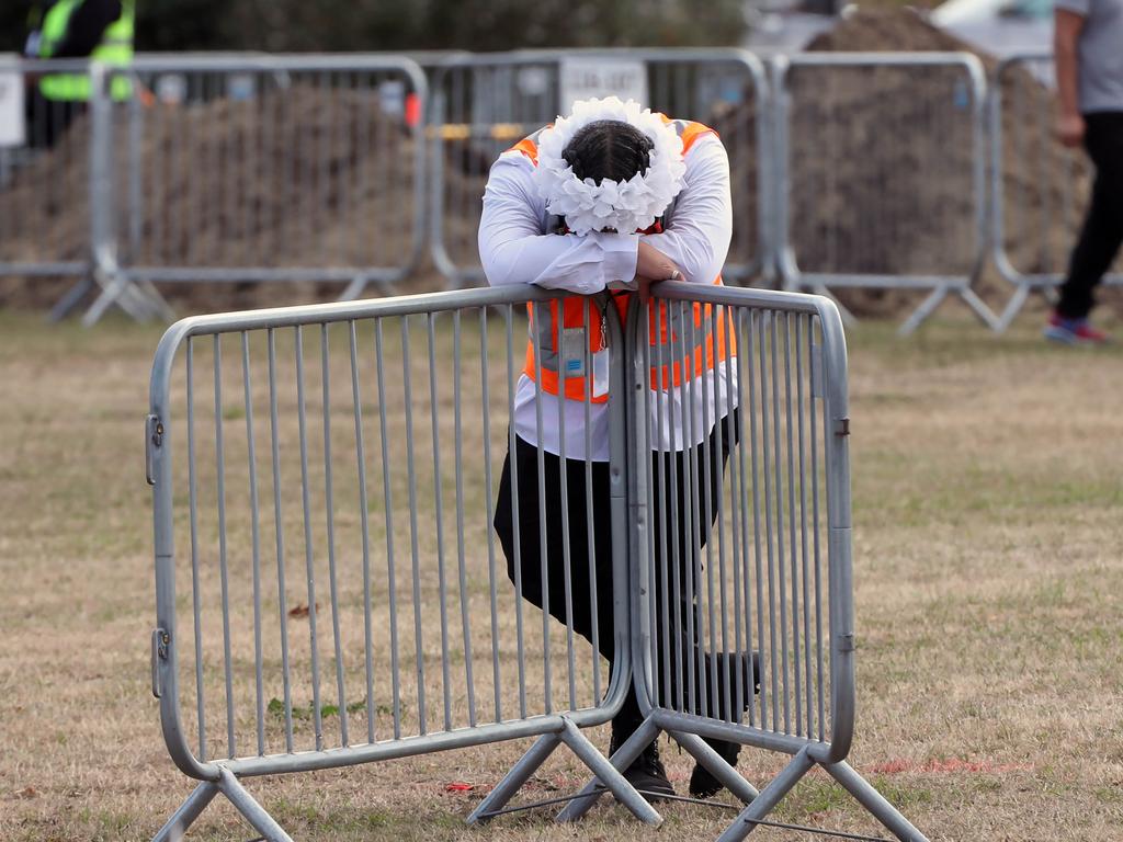 A young man waits for the burials to begin at Memorial Park Cemetery. Picture: Gary Ramage