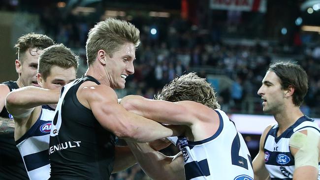 Hamish Hartlett and Josh Caddy tangle. Sadly that was just about Hartlett’s greatest impact. Picture: Sarah Reed